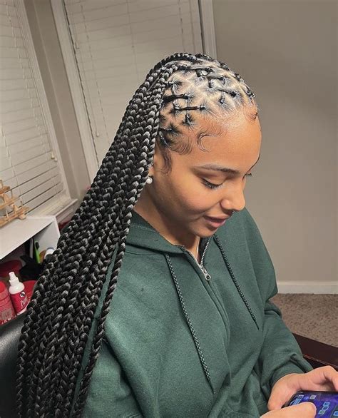 This next style shows smaller braids. . Rubberband knotless braids